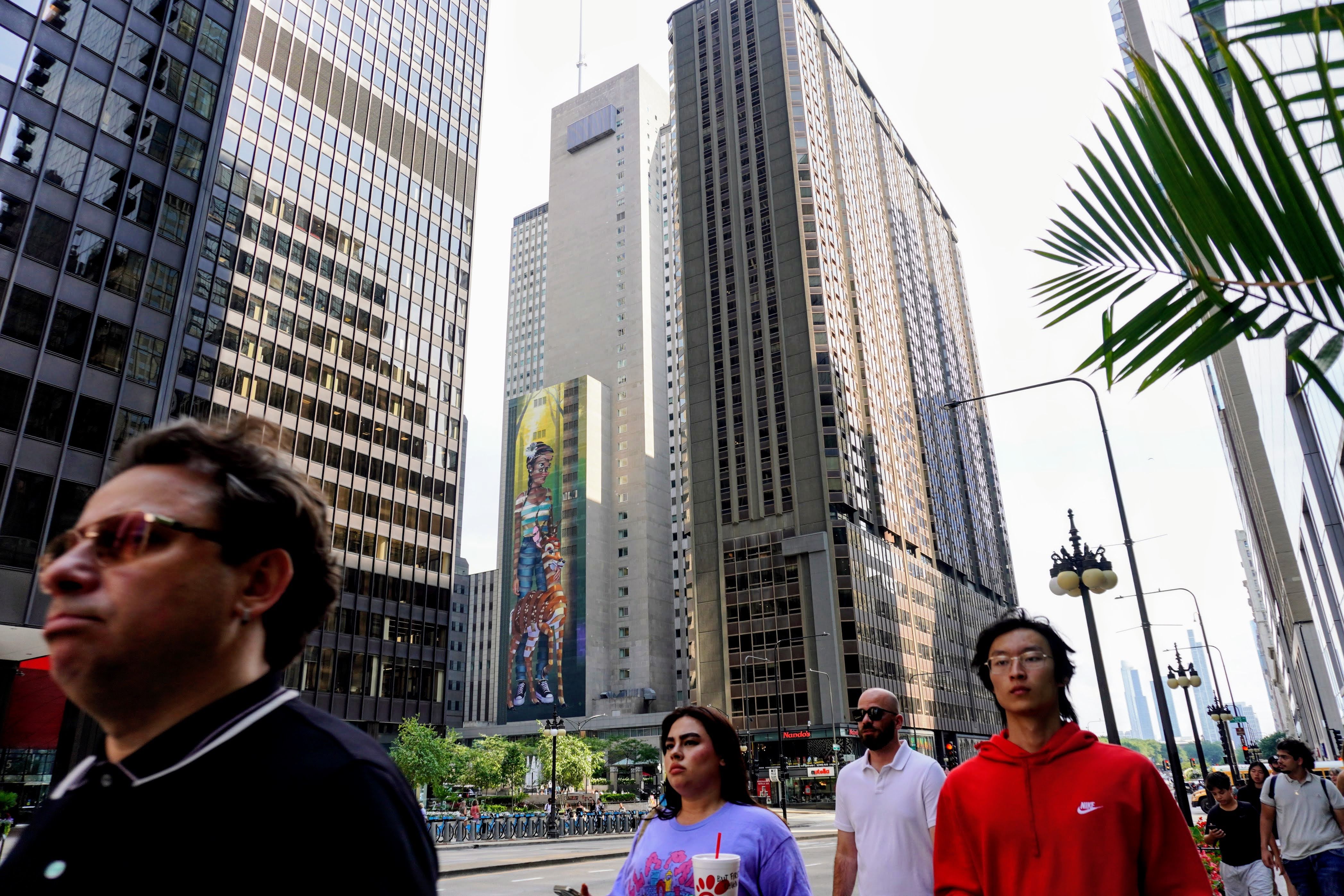 People walk on Michigan Avenue in Chicago on a Monday afternoon.